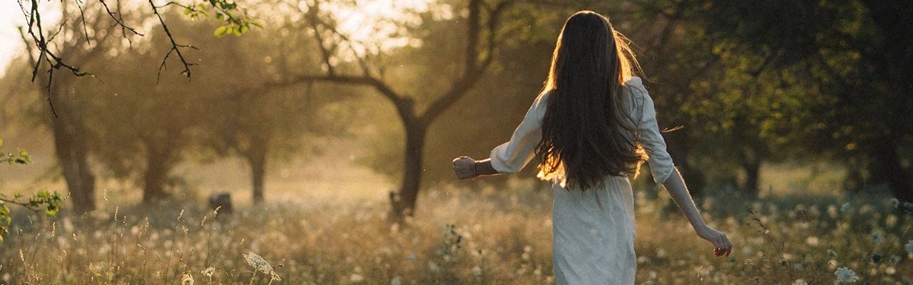 woman in the sunlit forest