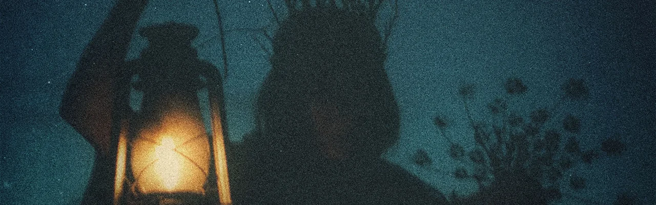 dark female silhuette and lamp